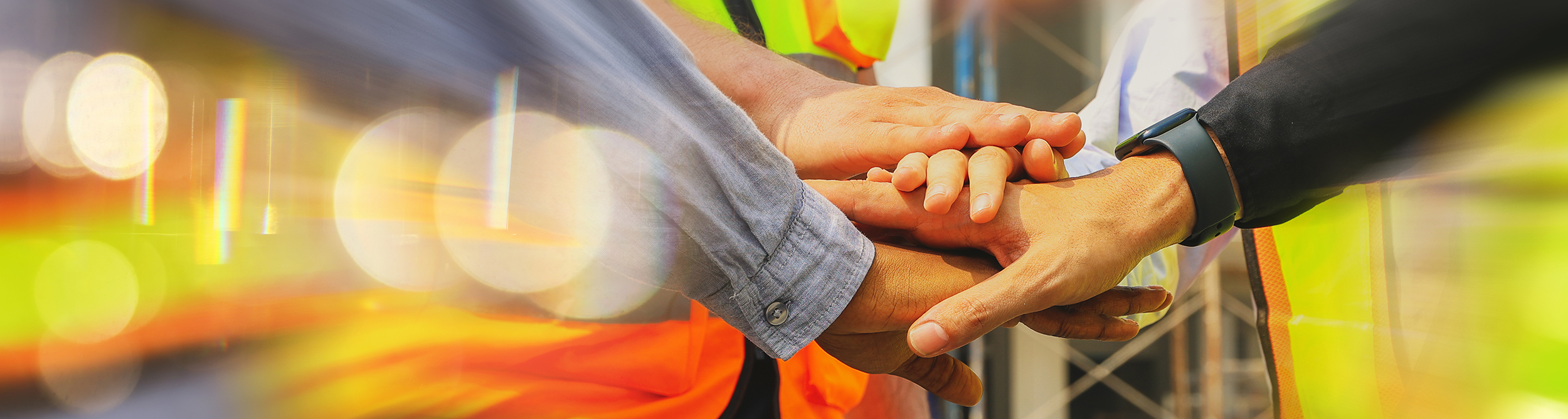 Workers-join-hands-AdobeStock 716490854-resized.jpeg